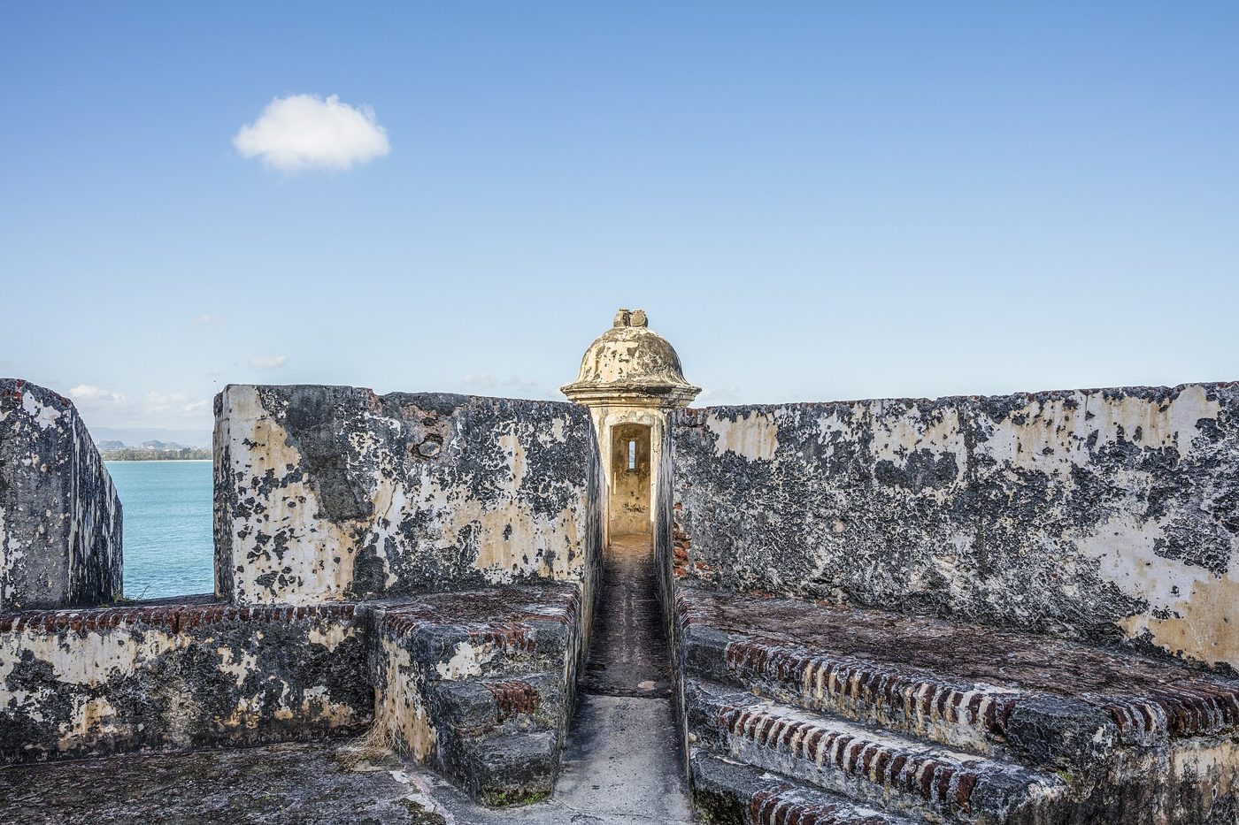 Stone walls of the Castillo San Felipe del Morro fortress above the sea in Old San Juan, Puerto Rico